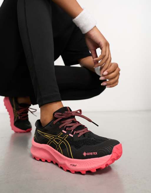 Asics - Hardlopen - Trabuco 11 GTX - Waterbestendige sneakers met contrasterende zool in zwart en roze