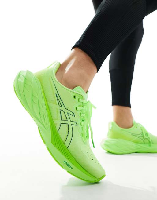 Asics Novablast 4 running trainers in illuminate green and lime burst