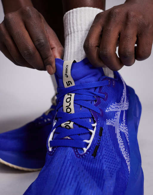 Asics Novablast 5 running trainers in cobalt blue and white, 4 of 5