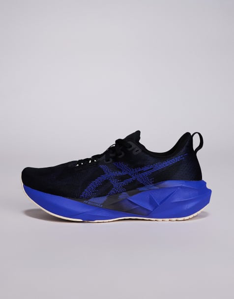 Asics Novablast 5 trainers in black and blue - view 2