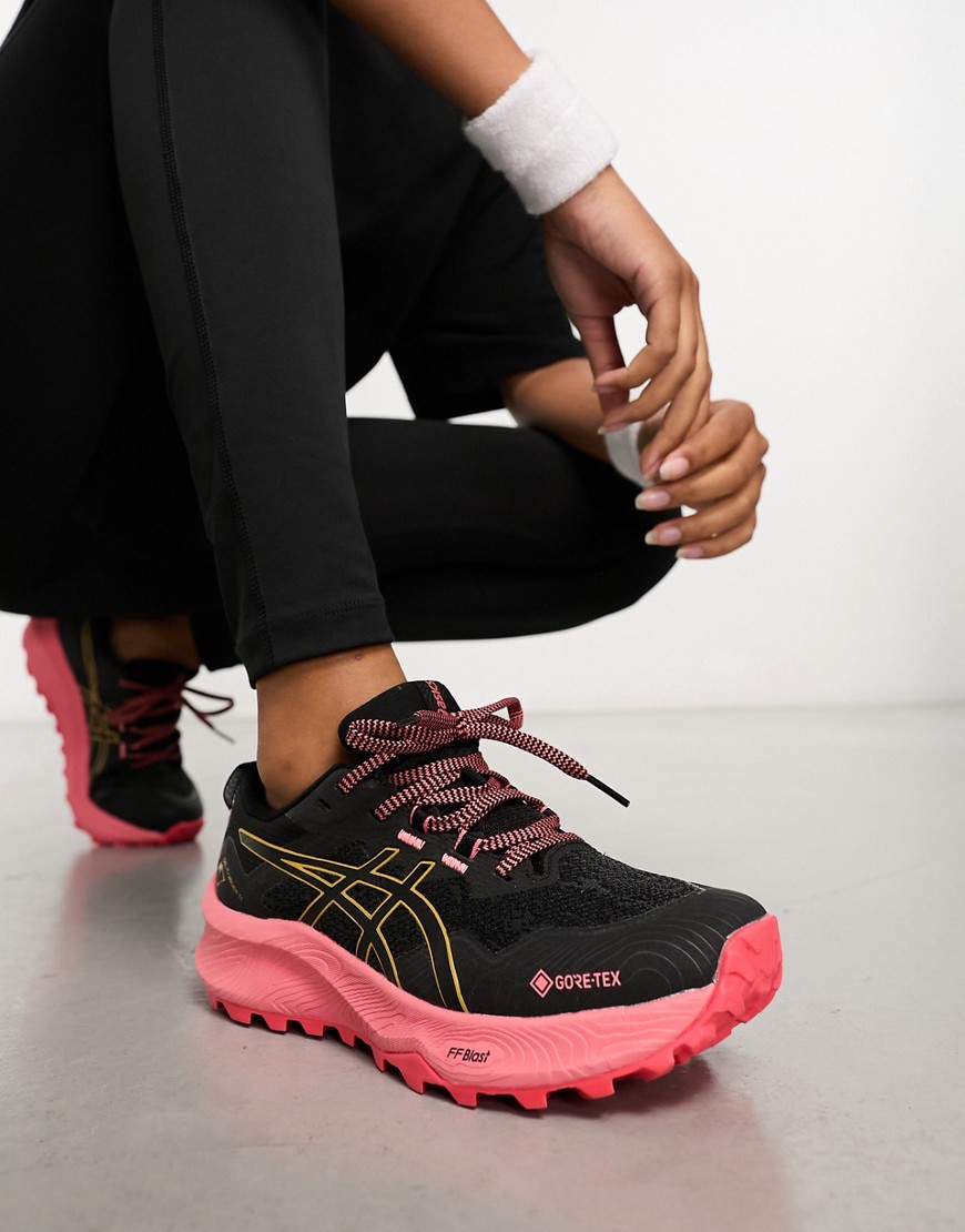 Asics Running Trabuco 11 GTX waterproof trainers with contrast sole in black and pink