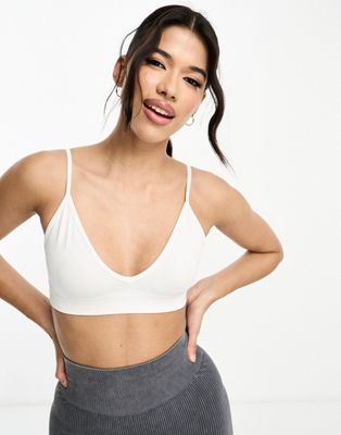 ASOS 4505 Icon seamless active intimate light support sports bra in white - ASOS Price Checker