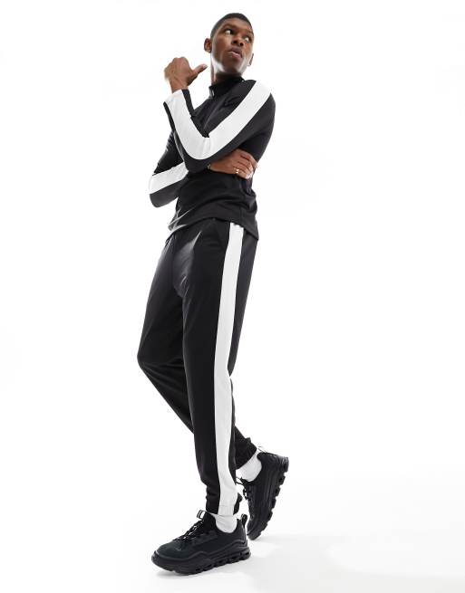 Nike pants side on sale stripe