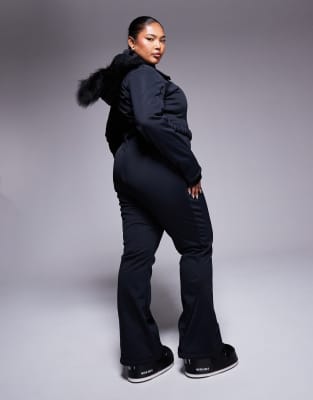 Asos Design 4505 Curve Icon Belted Ski Suit With Slim Kick Leg And Faux Fur Hood In Black