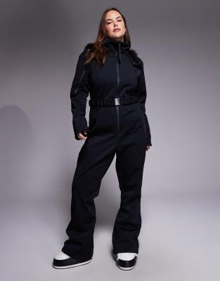 ASOS 4505 Curve - Ski - Skianzug aus Softshell in Schwarz mit schmalem, ausgestelltem Bein, Gürtel und Kapuze mit Kunstp...