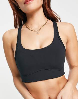 ASOS 4505 medium support sports bra in cracked leather effect in black