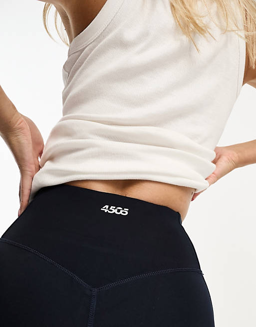 ASOS 4505 Hourglass Icon 7/8 leggings with bum sculpt seam detail and  pocket in navy