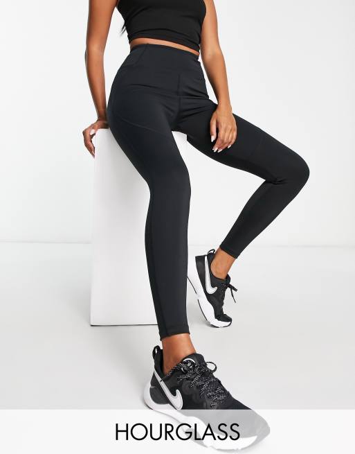 ASOS 4505 Hourglass Icon 7/8 leggings with bum sculpt seam detail and  pocket in navy