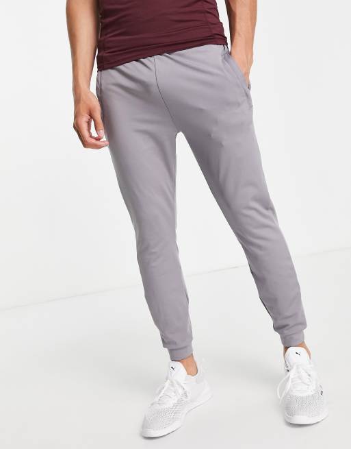 ASOS 4505 – Icon – Eng geschnittene Trainingsjogginghose aus Quick-Dry-Material in Grau 
