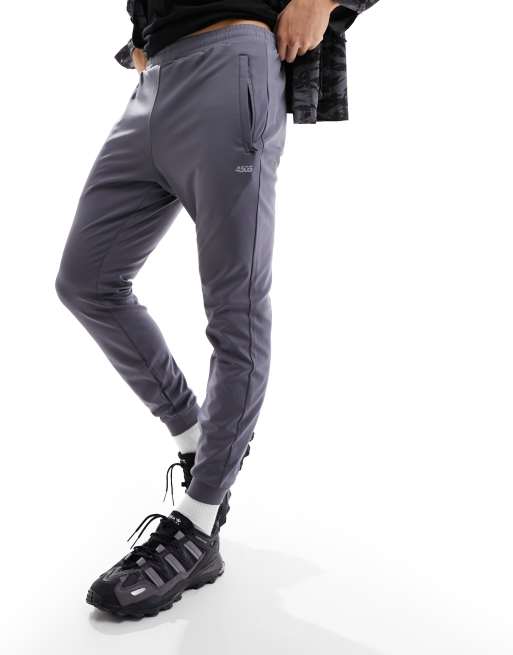 ASOS 4505 – Icon – Schmal geschnittene Trainings-Jogginghose in Anthrazitgrau aus schnell trocknendem Material 