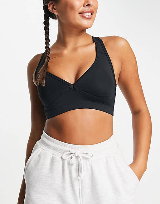 ASOS 4505 medium support sports bra with removable padding in
