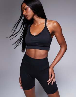 ASOS 4505 Seamless contour medium support cross back sports bra with removable padding in black