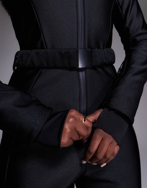 ASOS 4505 Ski soft shell belted ski suit with slim kick leg and faux fur hood in black gloss