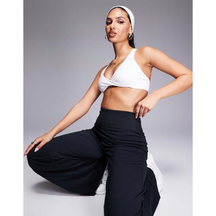ASOS 4505 soft touch light support twist front sports bra in white ASOS