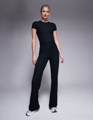 Asos Design 4505 Petite Soft Touch Rib Wide Leg Dance Pant In Black
