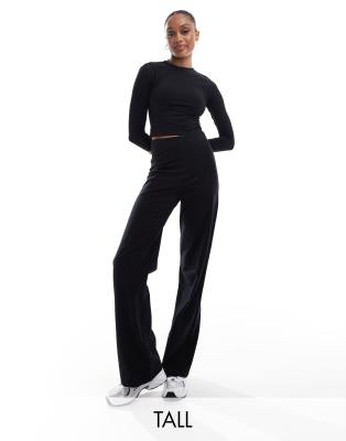 ASOS 4505 Tall - Studio - Tanzhose in Schwarz mit weitem Bein, weicher Haptik und Markenlogo