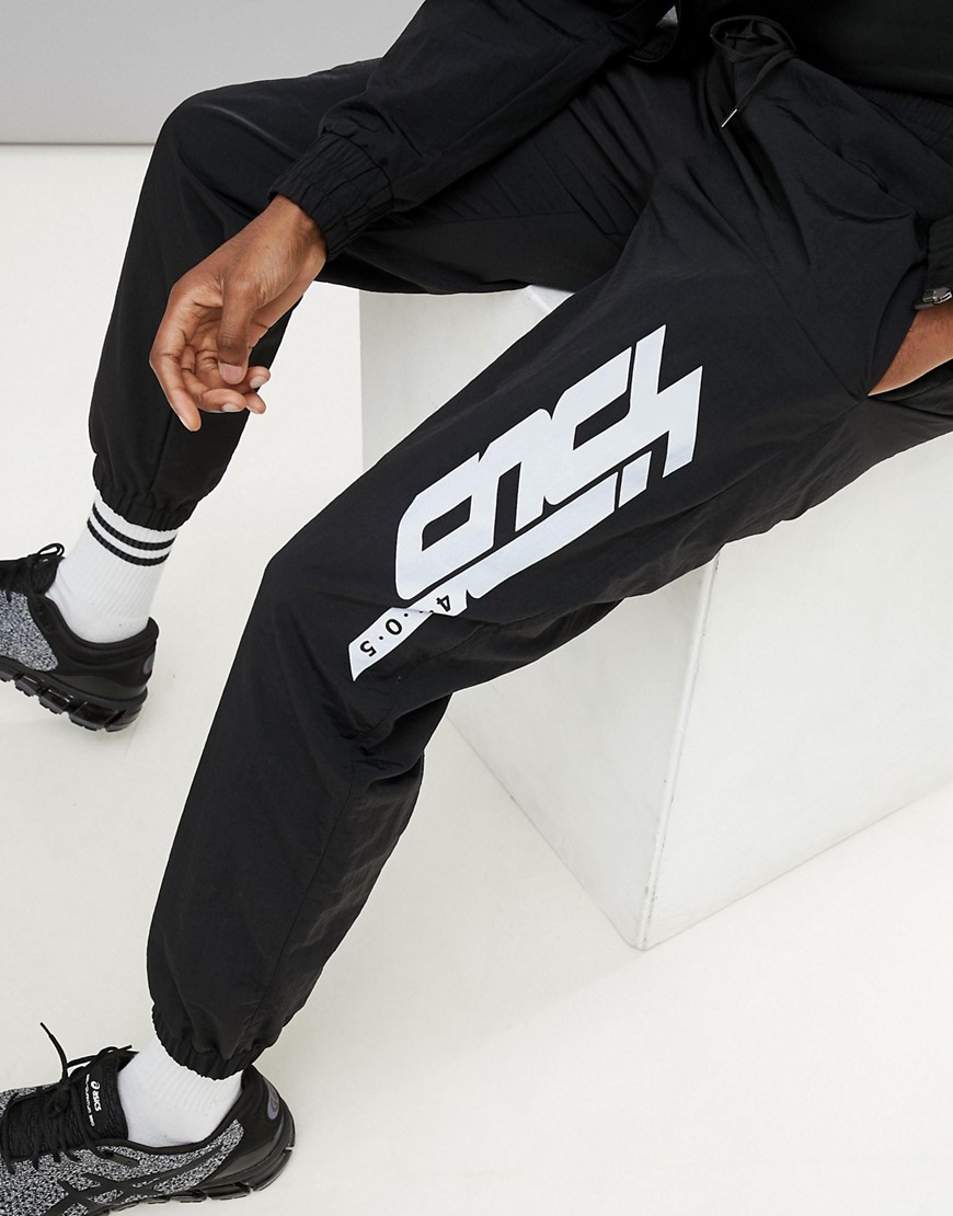 ASOS 4505 woven joggers with reflective print in black