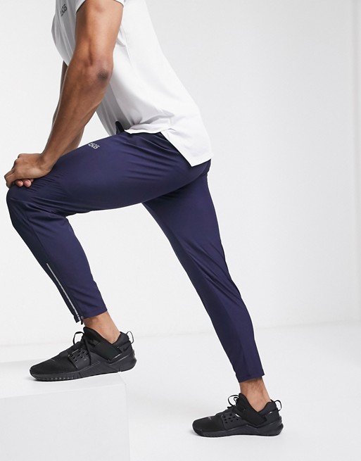 ASOS 4505 woven skinny tapered running joggers with reflective zip detail in navy