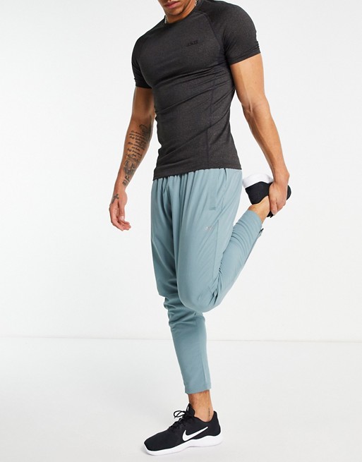 ASOS 4505 woven skinny tapered running joggers with reflective zip detail