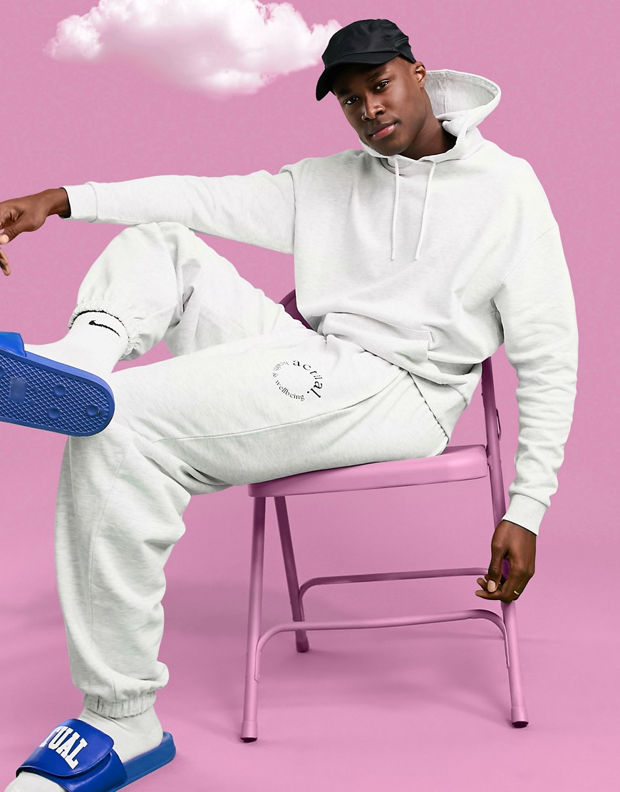 ASOS Actual Athleisure oversized sweatpants in white heather with health and wellbeing print