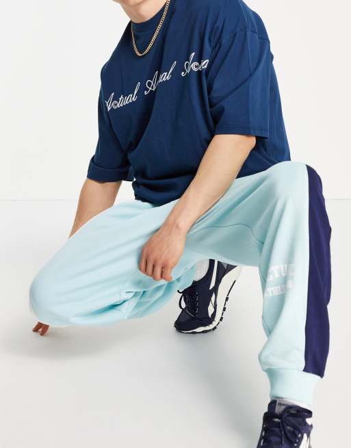 ASOS Actual co-ord oversized trackies with colour-block cut-and-sew detailing and logo print in blue