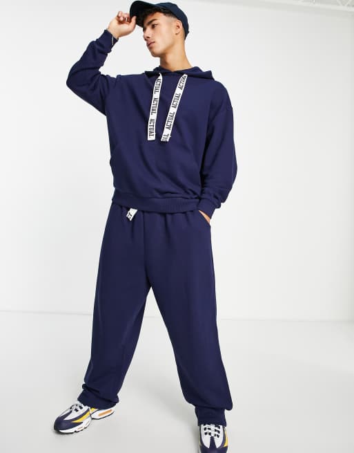 ASOS Actual co-ord relaxed joggers with back leg logo print and printed drawcords in blue, 2 of 4