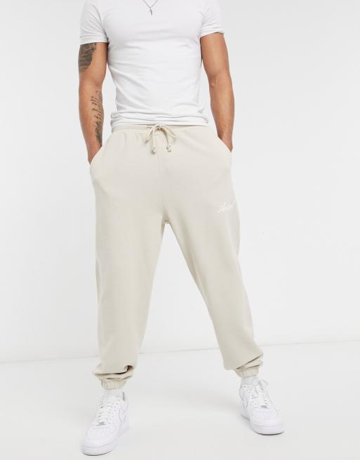 ASOS Actual co-ord relaxed trackies in beige with script print in stone