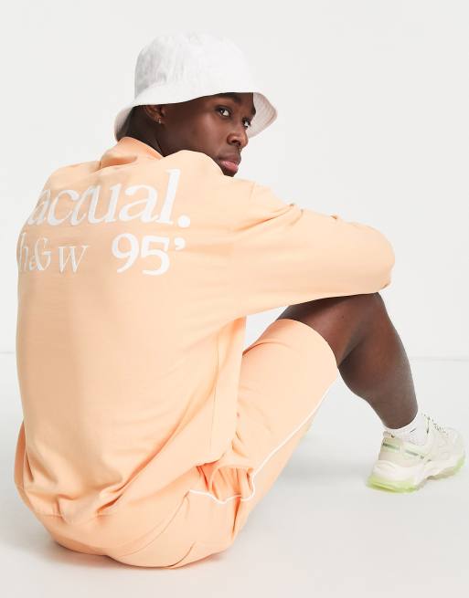 ASOS Actual health and wellbeing co ord oversized sweatshirt with logo puff prints and piping in coral ASOS
