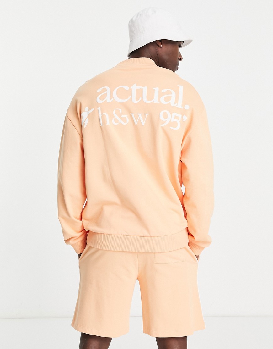 ASOS Actual health and wellbeing oversized sweatshirt with logo puff prints and piping in coral - part of a set-Orange
