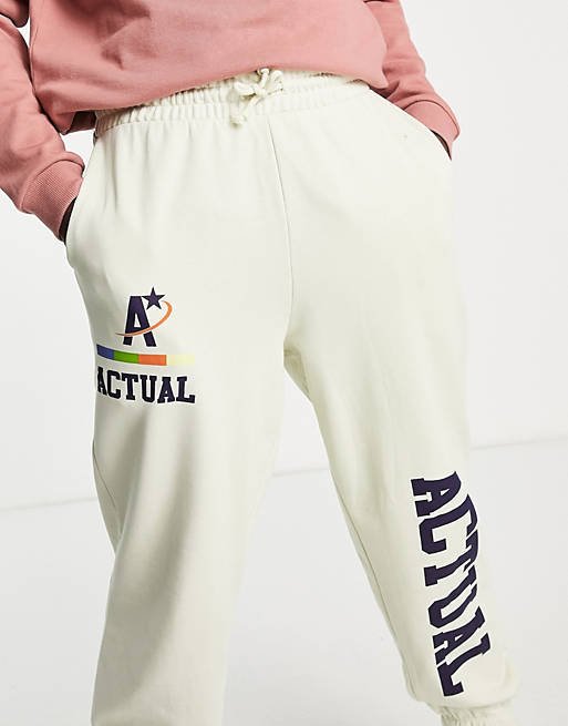 Men oversized joggers with graphic print and logo in cream 