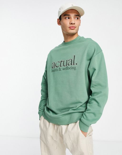 ASOS DESIGN oversized sweatshirt with The Grinch print in green