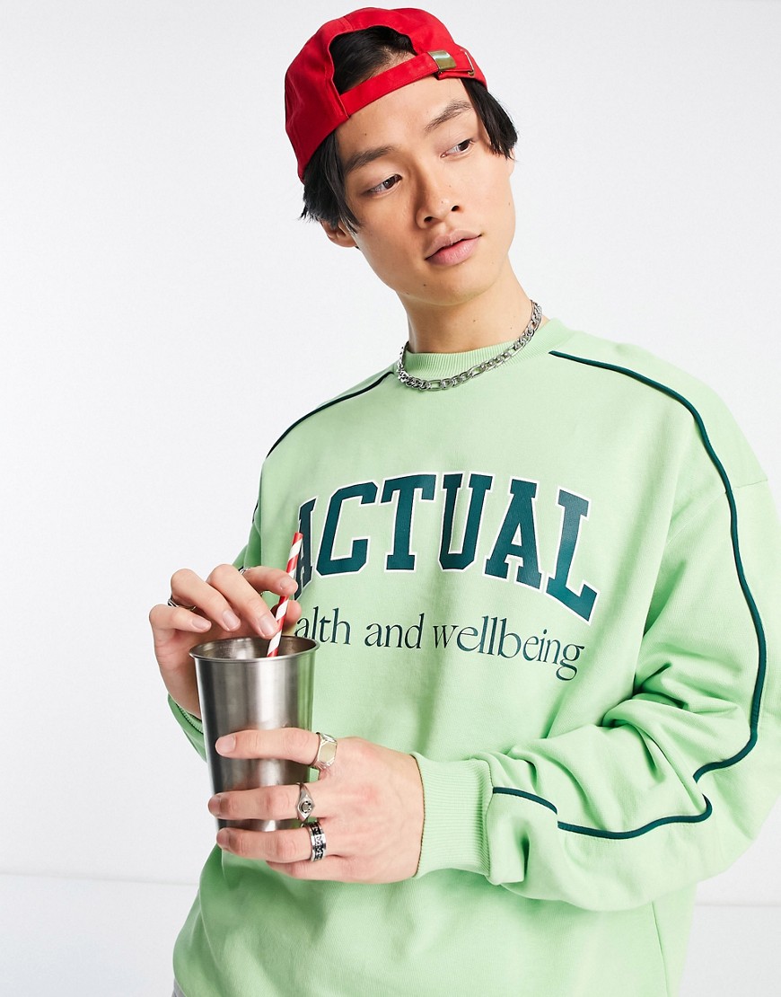 ASOS Actual oversized sweatshirt with logo print and piping detail in green