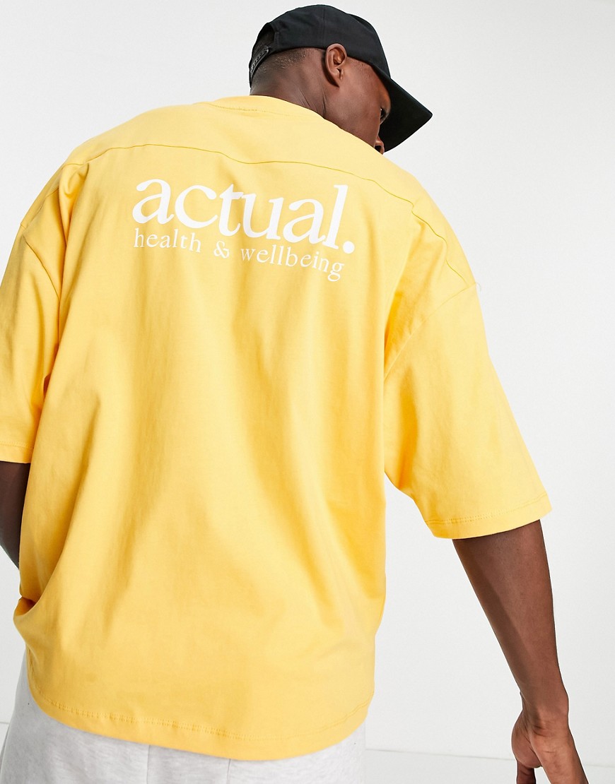 ASOS Actual oversized tshirt in yellow with printed logo and tab detail
