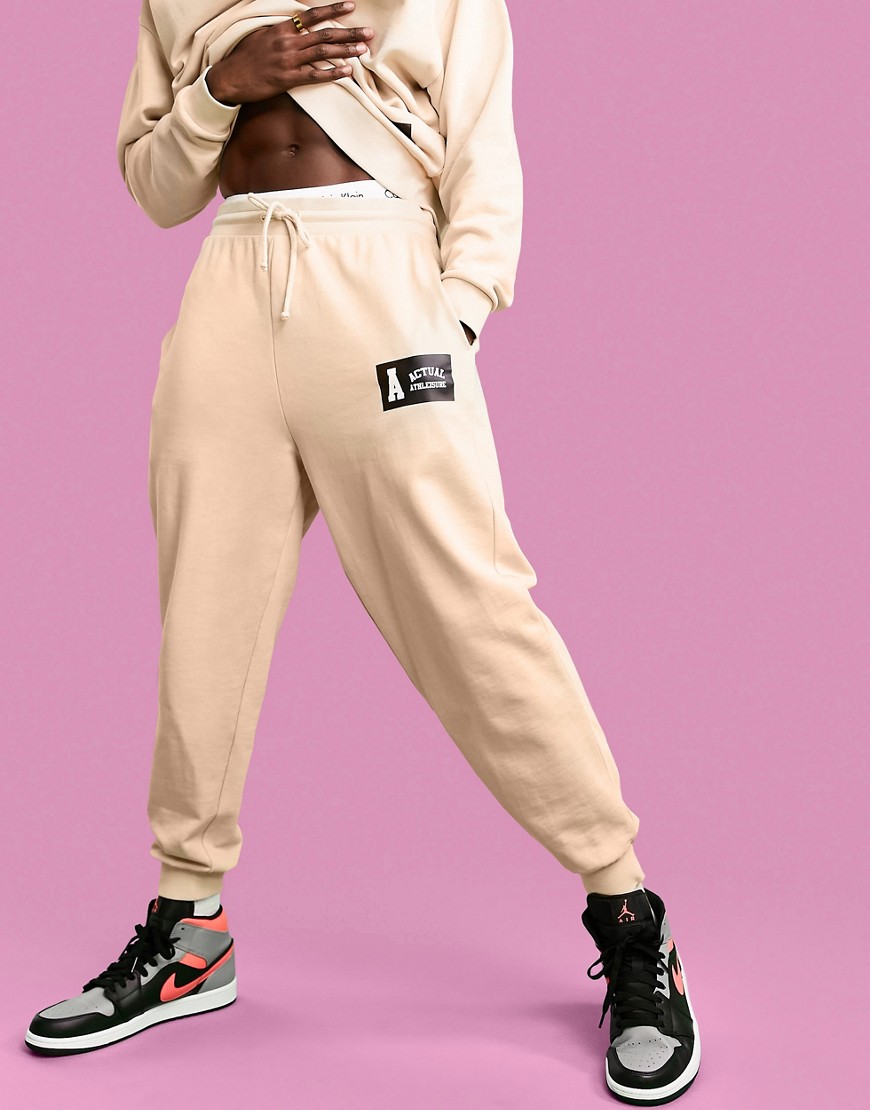 ASOS ACTUAL RELAXED SWEATPANTS IN SAND WITH LOGO BADGE PRINT - PART OF A SET-NEUTRAL,ACTUAL TEA SAND CO J