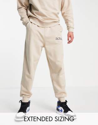 ASOS Actual relaxed sweatpants with logo print in neutral - part of a set