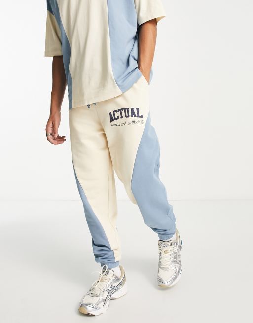 ASOS Actual relaxed trackies with curved cut-and-sew detailing in multi (Part of a set)