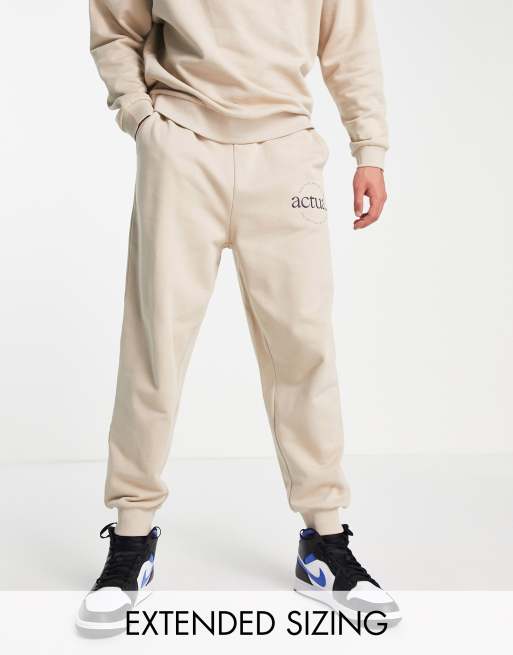 ASOS Actual relaxed trackies with logo print in neutral (part of a set)