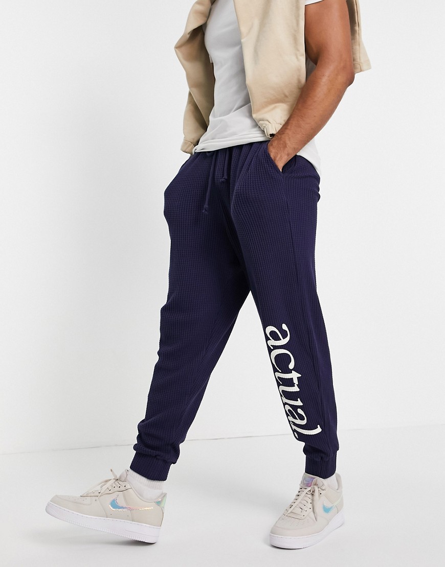 ASOS Actual set relaxed sweatpants in waffle texture with logo print in navy