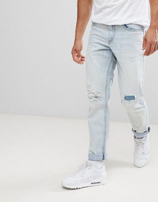 ASOS – Blekta skinny jeans med lappade revor-Blå