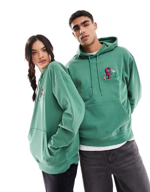 ASOS Crooked Tongues Unisex Kapuzenpullover in Grun mit Oversize Schnitt und Print ASOS