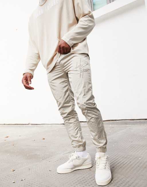 ASOS – Dark Future – Beige mjukisbyxor i nylon med extra smal passform