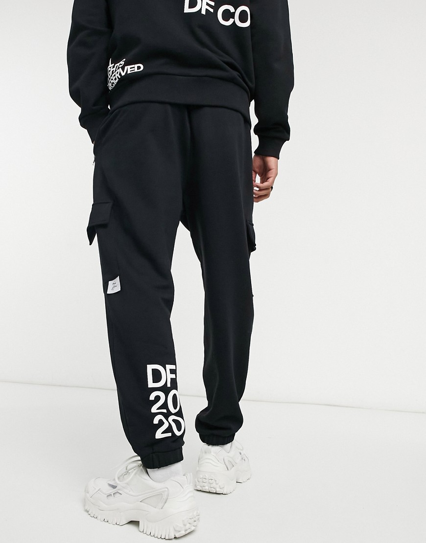 ASOS Dark Future co-ord oversized joggers in black with multi-placement print