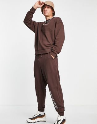 ASOS Dark Future co-ord relaxed joggers with logo print in chocolate brown