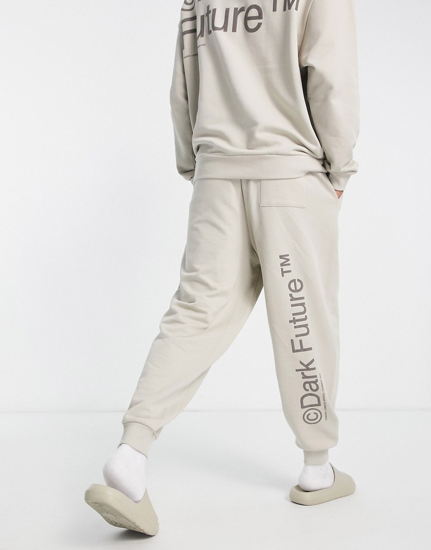 ASOS Dark Future co-ord relaxed joggers with multi puff prints and woven label in neutral