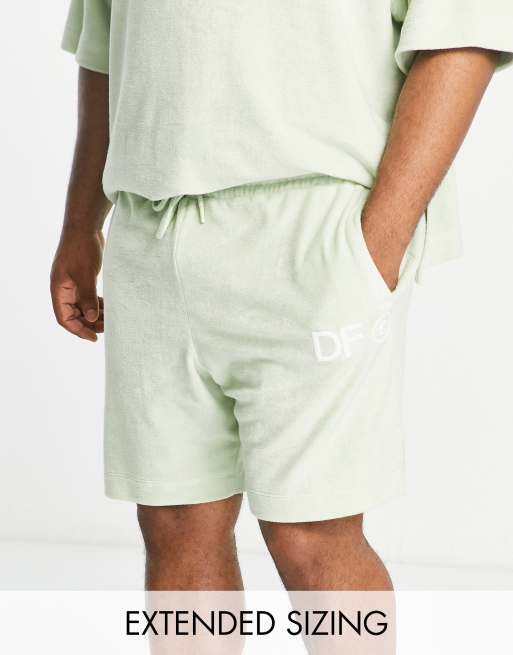 ASOS Dark Future co-ord relaxed shorts in towelling with side splits and logo embroidery in light green