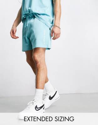 ASOS Dark Future co-ord relaxed shorts with logo graphic print in blue - ASOS Price Checker