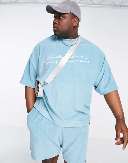 ASOS Dark Future – Jaskrawoniebieski T-shirt oversize z wyhaftowanym logo na środku z materiału frotte