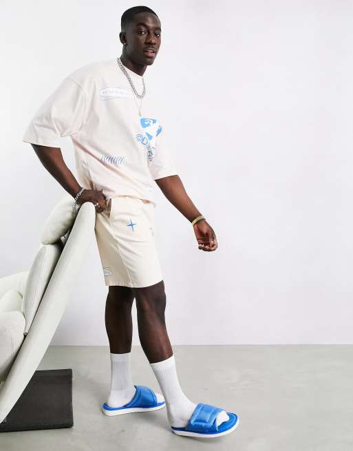 ASOS Dark Future jersey shorts in shell pink with logo print - part of a set