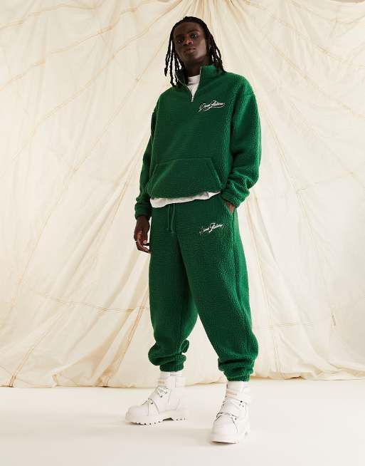 ASOS Dark Future - Joggers comodi in pile borg verde scuro con logo in coordinato