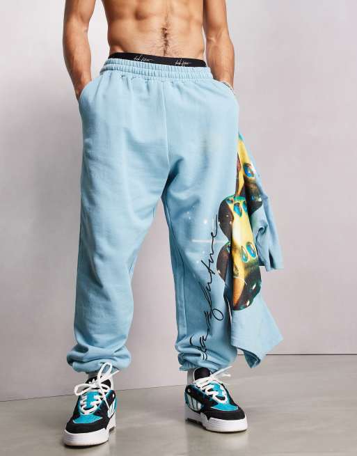 ASOS – Dark Future – Locker geschnittene Jogginghose in Aquablau mit Würfel-Grafikprint und Logo, Kombiteil